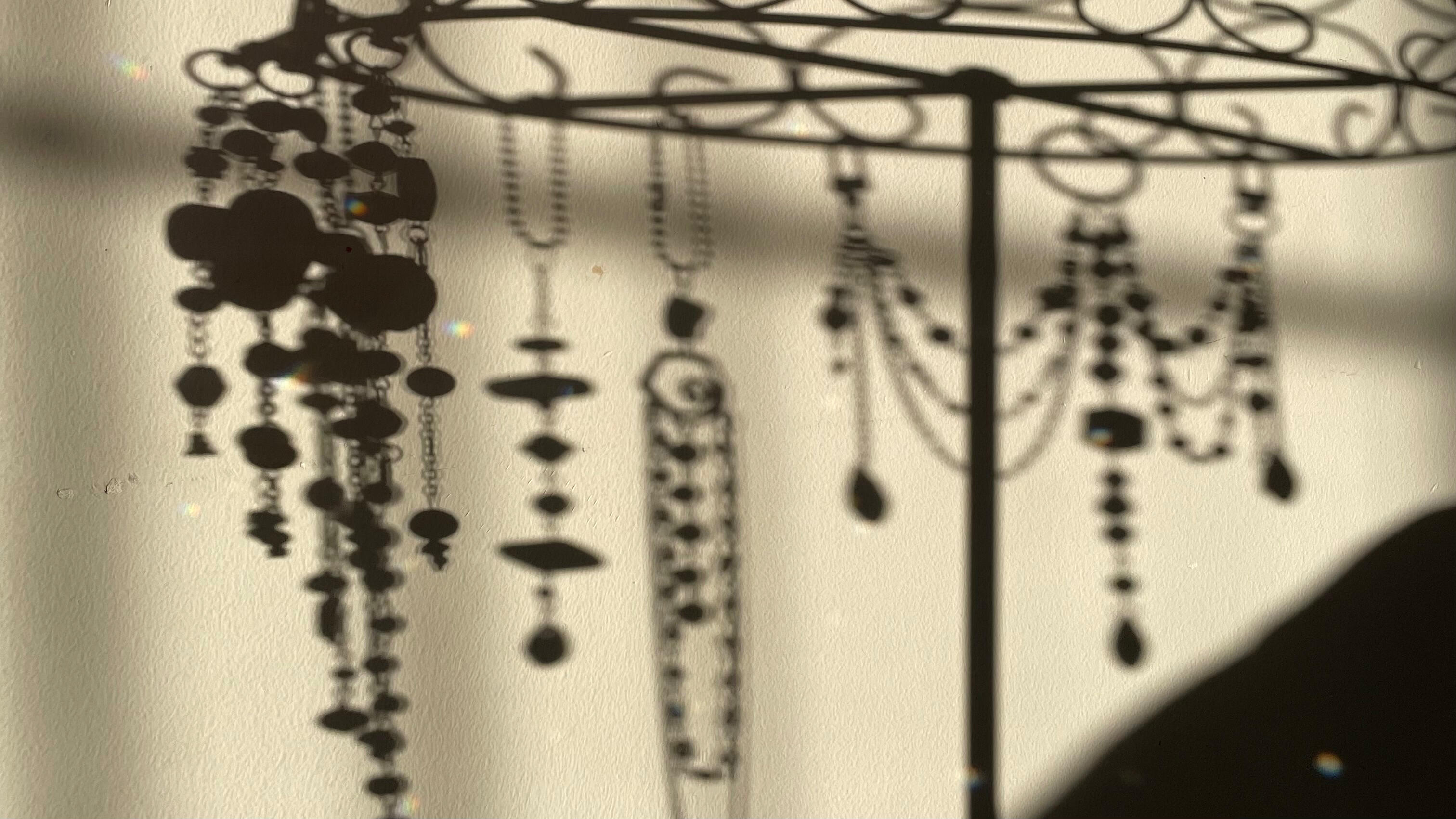 Shadows cast by handmade hanging objects from the Collected by the Tide collection.